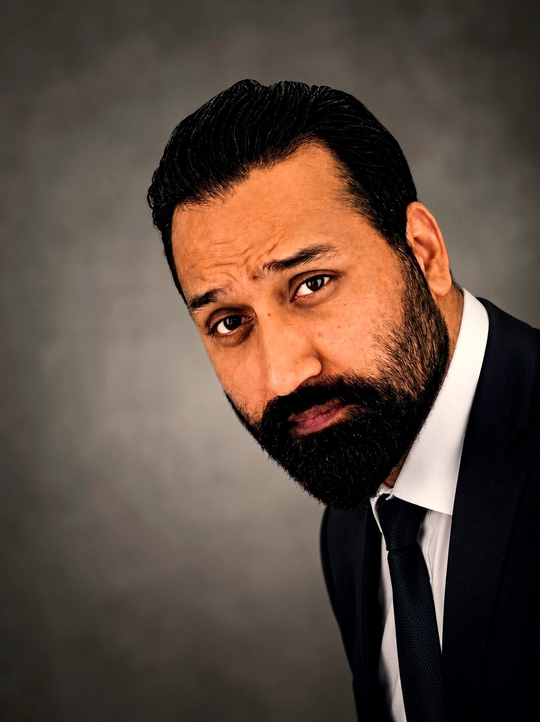 Ish in a navy suit and tie — the 100% clean corporate look